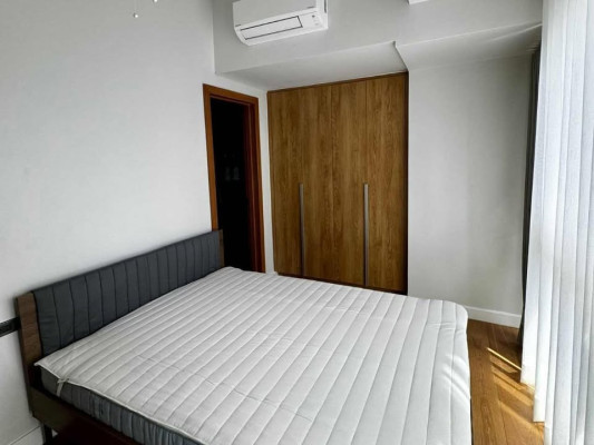 Fully-furnished 2-bedroom condo with balcony and parking for sale