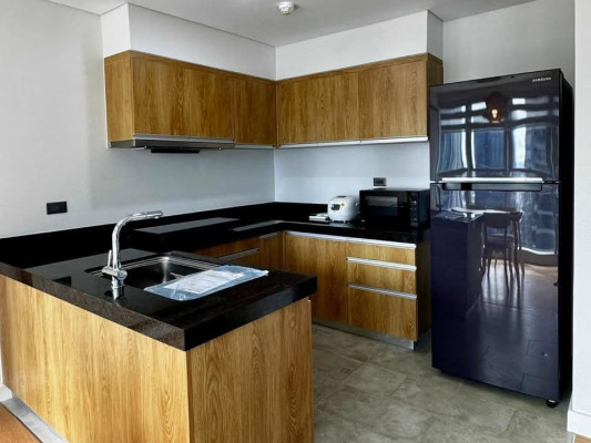 Fully-furnished 2-bedroom condo with balcony and parking for sale