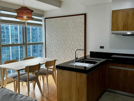 Fully-furnished 2-bedroom condo with balcony and parking for sale