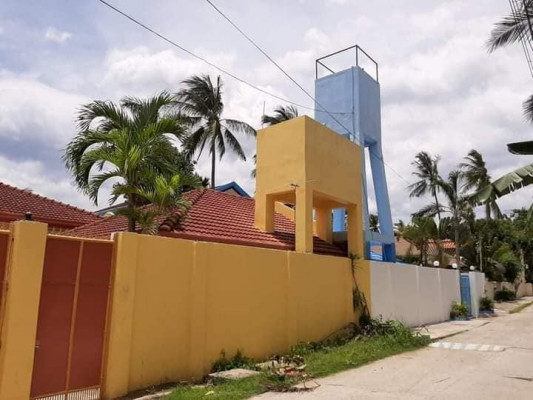 Beach lot property with fully air conditioned house for sale