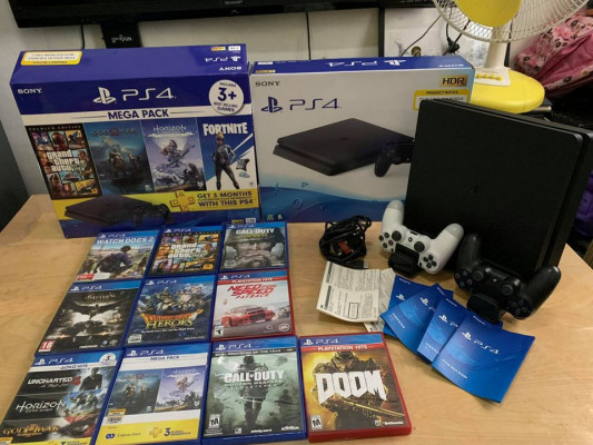 Ps4 1 terabyte with 11 cds 5dl games 2 ds4 controller