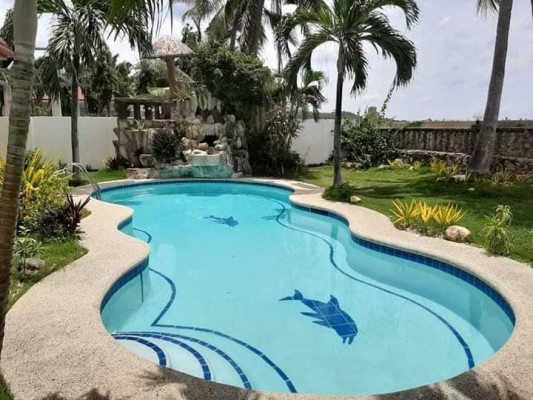 Beach lot property with fully air conditioned house for sale