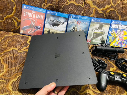 Ps4 slim 1TB Complete with games and pscamera