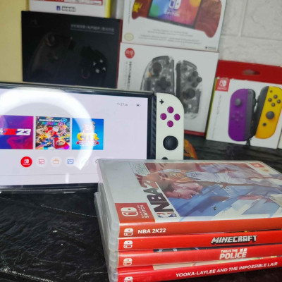 Switch OLED with 4 physical game and 11 digital games for sale