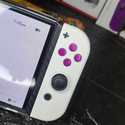 Switch OLED with 4 physical game and 11 digital games for sale