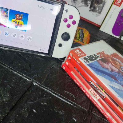 Switch OLED with 4 physical game and 11 digital games for sale