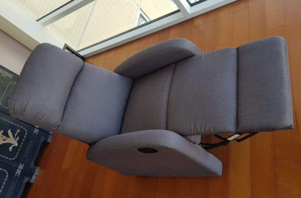 Slim and modern recliner in elegant grey fabric