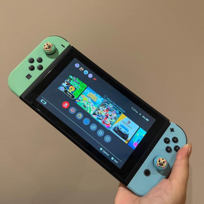 Nintendo Switch V2 Animal Crossing edition with Mario Kart Deluxe