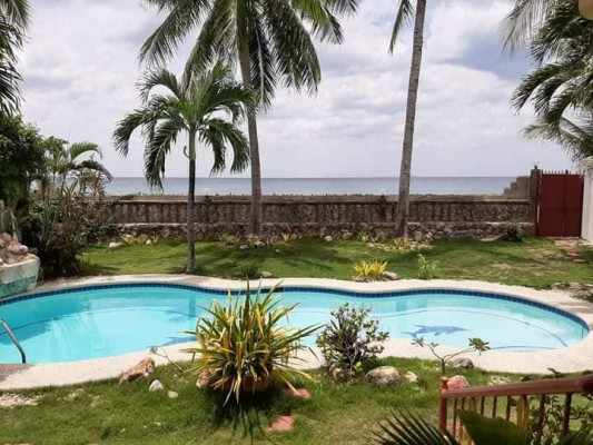 Beach lot property with fully air conditioned house for sale