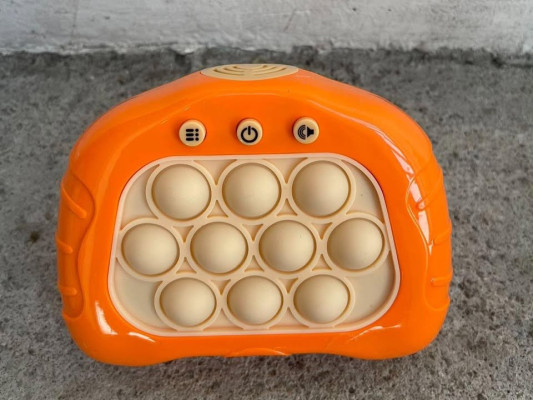 electric pop it battery operated hand held toy