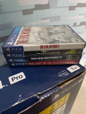 Ps4 pro 1TB complete with 4 physical games