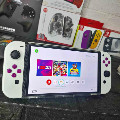 Switch OLED with 4 physical game and 11 digital games for sale
