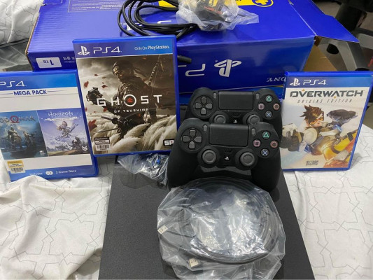 PS4 1TB with 2 controllers 4 games
