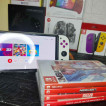 Switch OLED with 4 physical game and 11 digital games for sale