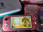 Selling Nintendo Switch Lite with 2 game