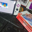 Switch OLED with 4 physical game and 11 digital games for sale