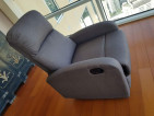 Slim and modern recliner in elegant grey fabric