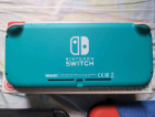 Turquoise Nintendo Switch Lite with accessories