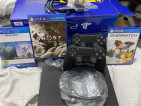 PS4 1TB with 2 controllers 4 games